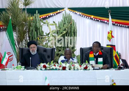 Harare, Harare, Zimbabwe. 13th July, 2023. Zimbabwe President EMMERSON MNANGAGWA (R) meets Iranian President EBRAHIM RAISI (L) in Harare. (Credit Image: © Iranian Presidency via ZUMA Press Wire) EDITORIAL USAGE ONLY! Not for Commercial USAGE! Stock Photo