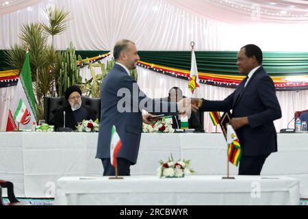 Harare, Harare, Zimbabwe. 13th July, 2023. Zimbabwe President EMMERSON MNANGAGWA (R) meets Iranian President EBRAHIM RAISI (L) in Harare. (Credit Image: © Iranian Presidency via ZUMA Press Wire) EDITORIAL USAGE ONLY! Not for Commercial USAGE! Stock Photo