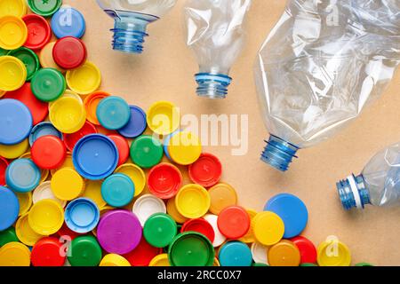 Colorful bottle caps recycling bottles crumpled plastic recycling PET waste recycling garbage PET plastic garbage separation. Separate waste plastic Stock Photo