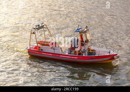 Paris, France - January 20, 2022: Firefighter team on boat on the Seine River in Paris, France. Stock Photo