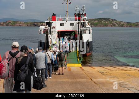 Isle of Iona, Scotland, UK.  6 June 2023.  Foot passengers departing the Isle of Iona to a inter island ferry Loch Buie to Fionnphort, Isle of Mull. Stock Photo