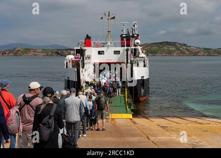 Isle of Iona, Scotland, UK.  6 June 2023.  Foot passengers departing the Isle of Iona to a inter island ferry Loch Buie to Fionnphort, Isle of Mull. Stock Photo