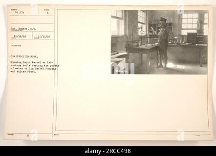 "Captain M.L. Warrel conducts water purity tests at the Big Bethel Pumping and Filter Plant during construction work. Sergeant 1 Bonner assists in supporting the operation. Photograph taken on October 13, 1919. Official description issued, symbolizing construction work at the plant. Photo number: R0/18/19." Stock Photo