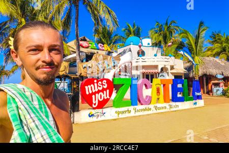 Traveler and Tourist at the colorful Zicatela Puerto Escondido