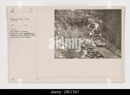 French soldiers construct highways in Alsace, which had been reconquered from Germany. The soldiers actively work to improve infrastructure in the region, contributing to the post-war recovery efforts. This image captures the ongoing construction efforts during the period of American military activities in World War I. Stock Photo