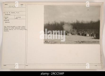 3rd Section, Battalion A, 142nd Field Artillery, 64th Brigade, led by Lt. R. W. Sears, S.C., firing French 155mm guns in Le Valdahon, Doubs, France. This photograph was taken on April 5, 1919, by an unknown photographer and was assigned the official number 51475 on February 5, 1919. Stock Photo