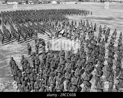 Soldiers of 41st Engineers in formation on Parade Ground with Sergeant Franklin Williams in color guard, Fort Bragg, North Carolina, USA, Arthur Rothstein, U.S. Office of War Information, March 1942 Stock Photo