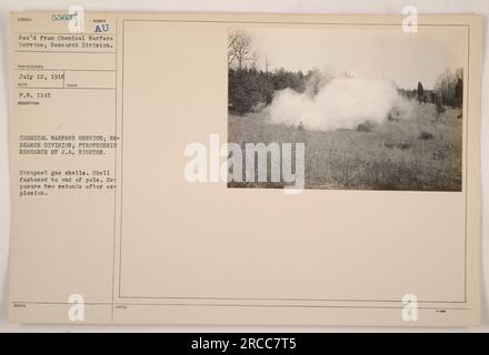 Chemical Warfare Service, Research Division conducted pyrotechnic research under J.A. Richter in 1918. This photograph, taken on July 12, shows a shrapnel gas shell fastened to the end of a pole. The exposure captures the explosion two seconds after detonation. Received from Chemical Warfare Service; Research Division, this image is labeled subject 55637. Stock Photo