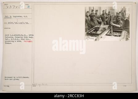 Cpl. R. Ingleston, S.C., prepares a stew in Bulligny, France. The photograph shows E COOK J.A. MILLER from HQ.Co., 165th Infantry, formerly 69th Regt. Inf., N.Y.N.G., 42nd Div., involved in cooking activities during World War One. The photo was received on October 25, 1918, and taken on September 7, 1918. It was released by the A.E.F. Censor and issued with the description number 73713. No specific date of release is provided. The initials 'MAO ay. Rc. R. 23723' are also mentioned. Stock Photo