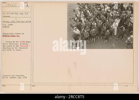 Troops of the 105th Regiment Field Artillery on board the transport ship 'Mercury,' cheering as they prepare to depart from Newport News, VA. The photograph was taken on June 30, 1918, by Lt. William Fox, Signal Corps. Censored and released by the M.I.B. Censor on August 1, 1918. Stock Photo