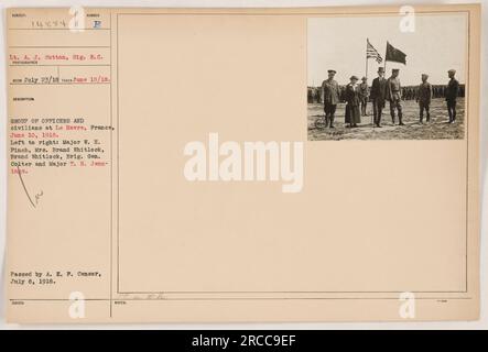 Group of officers and civilians posing for a photograph in Le Havre, France, on June 10, 1918. From left to right: Major W. H. Pinch, Mrs. Brand Whitlock, Brand Whitlock, Brig. Gen. Colter, and Major T. H. Jennings. The photo was taken by Lt. A. J. Sutton, Sig. R. C. on July 23, 1918 and was passed by A. E. F. Censor on July 8, 1918. (111-SC-14884) Stock Photo