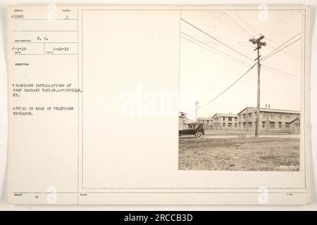 Telephone installations at Camp Zachary Taylor in Louisville, Kentucky. The aerial photo shows the rear of the telephone exchange. Taken on January 22, 1919. Subject number 43183. Photograph taken by photographer 4-2-19. Description: S.C. issued telephone installations at Camp Zachary Taylor, Louisville, KY. Submitter: 43183 photographer. Stock Photo