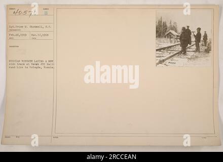 Sgt. Grier M. Shotwell, S.C. photograph taken on February 26, 1919, shows Russian workmen laying a new side track at Verst 455 on the railroad line to Vologda, Russia. This image is part of the collection with the identification number 40570 issued on November 14, 1918. Stock Photo