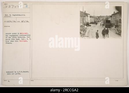 This is a black and white photograph taken on September 7, 1918, in Bulligny, France. The image shows a street scene with the regimental headquarters of the 165th Infantry, which was formerly known as the 69th Regiment Infantry of the New York National Guard's 42nd Division. The photograph was received on October 25, 1918, and was released by the A.E.P Censor. Stock Photo