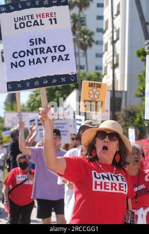 Los Angeles, California, USA. 13th July, 2023. Members of WGA and WGAW join UNITE HERE! Local 11 to support the striking hotel workers as they picket outside Fairmont Miramar Hotel & Bungalows in Santa Monica, California, July 13, 2023. (Credit Image: © Ringo Chiu/ZUMA Press Wire) EDITORIAL USAGE ONLY! Not for Commercial USAGE! Stock Photo