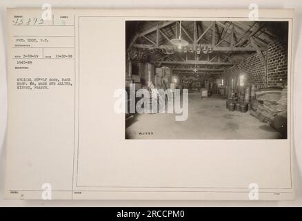 Image snapshot of the medical supply room at Base Hosp. 68, located in Mars Sur Allier, Nièvre, France during World War One. The photograph was taken on December 30, 1918, by an undisclosed photographer. The room contains various medical supplies and equipment and is labeled as '1945-N9' in the supply records. Private Eddy, S.C. is the primary subject of the photograph, identified with the individual's service number of 45892. The image is officially registered in the photographic archives as of March 28, 1919. Stock Photo