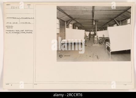 This photograph depicts the pneumonia ward at Camp Hospital No. 50 in Tonnerre, Yonne, France during World War I. It was taken on January 30, 1919, by photographer OT.A.L. Villanova, S.C. The image is part of a larger collection titled 'Photographs of American Military Activities during World War I.' Stock Photo