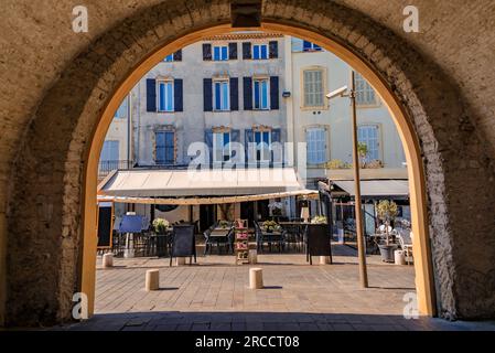 Arched passage way in the traditional medieval stone city walls of Old Town or Vieil Antibes, South of France Stock Photo