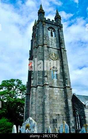 Widecome in the Moor - Maintenance repair work being carried out on church clock by abseiling workforce Stock Photo