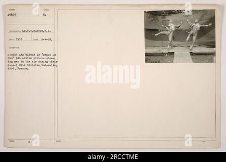 Soldiers from the 27th Division, known as Hughes and Martin, perform a daring aerial dance in the 'DANCE DE LUX,' an action picture show. The photograph was taken by Lt. F.O. Harris on August 4, 1918, in Oudozelle, Nord, France. Stock Photo