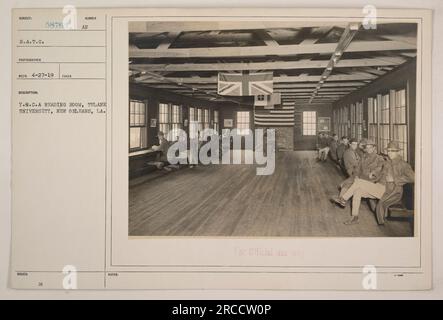 Inside the Y.M.C.A reading room at Tulane University, New Orleans, LA, during World War I. The photograph was taken by a photographer with Reco 4-27-19 taken description number 58762 AU. The room was established for the soldiers of the Student Army Training Corps (S.A.T.C), with restricted access for official use only. Stock Photo