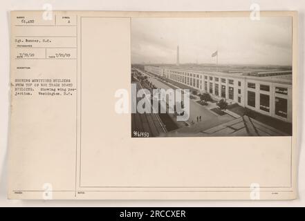 Bird's-eye view of the Munitions B Building in Washington, D.C. The photograph, taken by Sgt. Bonner on 7/21/19, shows the wing projection of the building from the top of the War Trade Board building. This image is part of a collection documenting American military activities during World War One, marked with the identification number 61,450 and the description 'A showing Munitions Building from top of War Trade Board Building.' Stock Photo