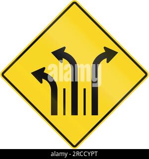 Warning road sign in Quebec, Canada - Three lanes with right and left turn lane. Stock Photo