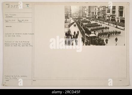 Sailors of the U.S. Victory Fleet parading in New York City on December 26, 1918. The photograph was taken by Sgt. Palumbo and received on December 31, 1918. The sailors are seen passing the reviewing stand at 42nd St. and 5th Ave. The photograph was approved by the M.I.D. censor on January 2, 1919. Stock Photo