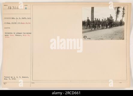 American soldiers seen bringing in German prisoners near Vaux, France on July 21, 1918. The photograph was taken by Sergeant A. G. Duff. Approved by A. E. P. Censor on August 6, 1918. This image has the identification number 16366. Stock Photo