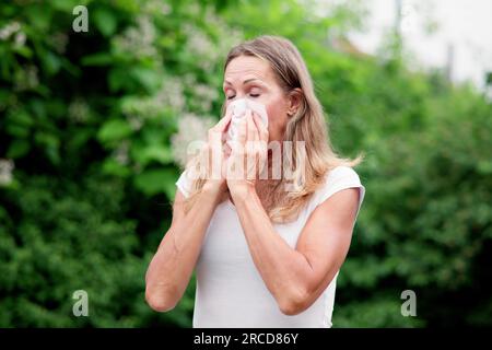 Allergic Nose And Pollen Allergy. Sneezing Into Handkerchief Stock Photo