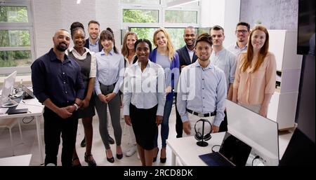 Happy Group Of Business People Standing In Office Stock Photo