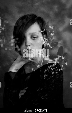 Artistic image of woman and flowers Stock Photo