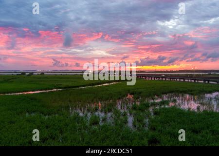 Pink sky at sunset on Mobile Bay, Alabama Stock Photo