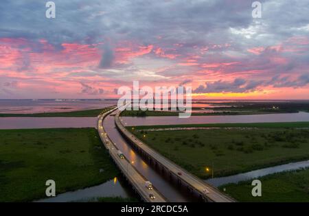 Pink sky at sunset on Mobile Bay, Alabama Stock Photo