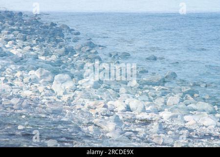 Creative dreamlike image of rocks by the sea Stock Photo