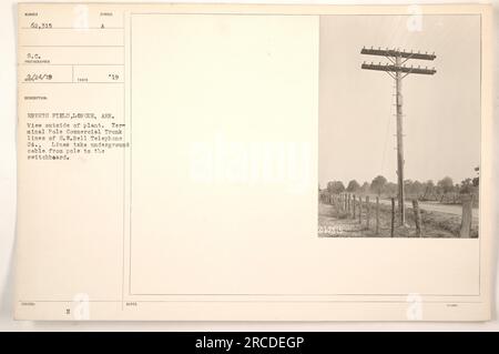 View of the exterior of Eberts Field in Lonoke, Arkansas. The image shows a terminal pole for the commercial trunk lines of the S.W.Bell Telephone Company. These lines transport underground cables from the pole to the switchboard. Photograph taken on February 24, 1919. Stock Photo