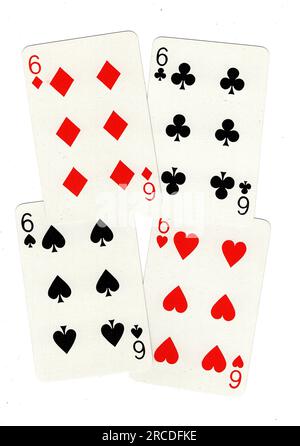 Vintage playing cards showing four sixes on a white background. Stock Photo