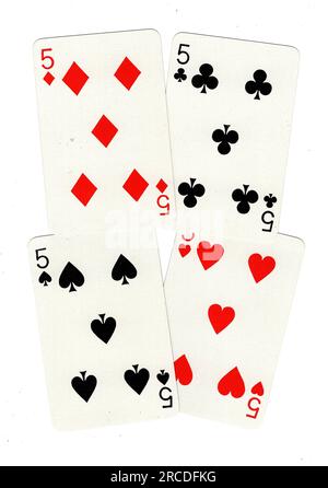 Vintage playing cards showing four fives on a white background. Stock Photo