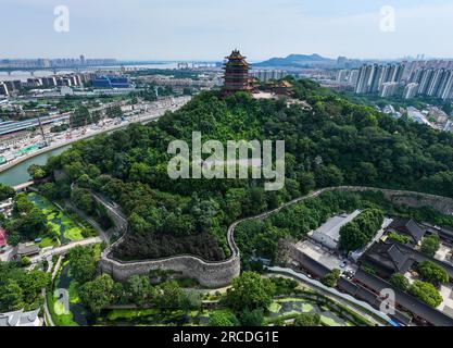 (230714) -- NANJING, July 14, 2023 (Xinhua) -- This aerial photo taken on July 12, 2023 shows the Yuejiang Tower in Nanjing, east China's Jiangsu Province. The ancient city Nanjing, with a history of around 2,500 years, has started many renewal projects along the Qinhuai River in recent years. This has helped bring the old and new together to create a brighter future of the city. Such urban renewal projects have also led to the prosperity of the cultural sector in the ancient city. In 2022, the added value of Nanjing's cultural industry reached 112 billion yuan (about 15.6 billion U.S. dollars Stock Photo