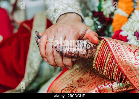 Newlywed couple holding hands together, Bride and Groom Hands Stock Photo