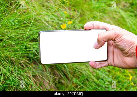Photo with a smartphone. Smartphone screen close-up. Smartphone in a man's hand Stock Photo