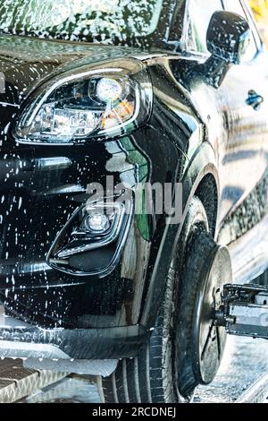 A motorcar in an automatic car wash. Stock Photo
