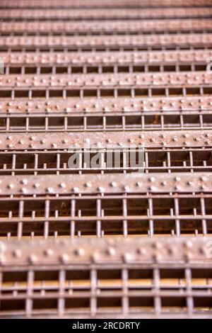 metal texture of rusty squares from a vintage industrial staircase Stock Photo