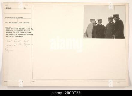 President Woodrow Wilson and Admiral Cary T. Grayson pictured on board the Brighton en route to Dover, England. Correction: the third individual is Admiral Sir Roger Keyes, not Sir Charles Cust. This photograph was taken in December 1918. Issued by the Signal Corps. Stock Photo