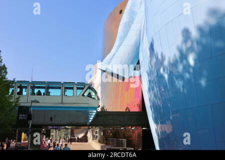 Museum of Pop Culture modern architecture building with the Seattle Centre Alweg Monorail train running through it Seattle Washington State USA Stock Photo