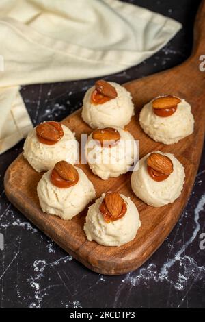 Almond and caramel cookies. Almond cookies on dark background Stock Photo