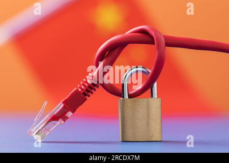 Closed lock on a network wire on the background of the flag, a concept on the theme of the closed Internet in China Stock Photo