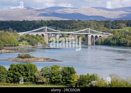 Menai Suspension Bridge crossing the Menai Strait from the Isle of Anglesey and the mainland of Wales. north-west Wales. UK Stock Photo