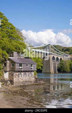 Menai Suspension Bridge crossing the Menai Strait from the Isle of Anglesey and the mainland of Wales. north-west Wales. UK Stock Photo