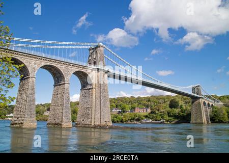 Menai Suspension Bridge crossing the Menai Strait from the Isle of Anglesey and the mainland of Wales. north-west Wales. UK Stock Photo